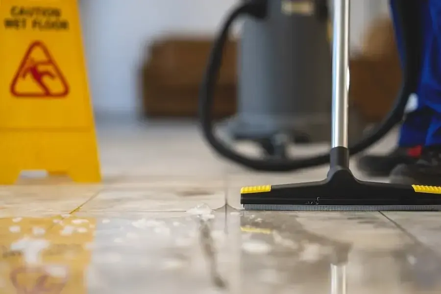 Technician extracting standing water from an Alexandria, VA floor